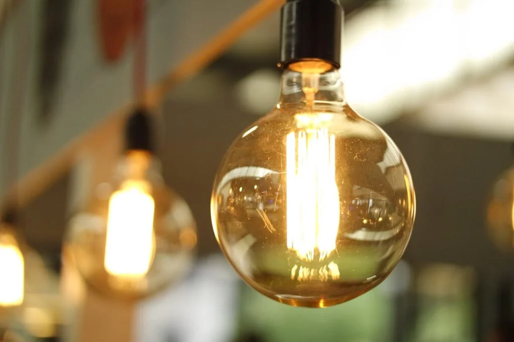 bulb glowing showing energy efficient homes