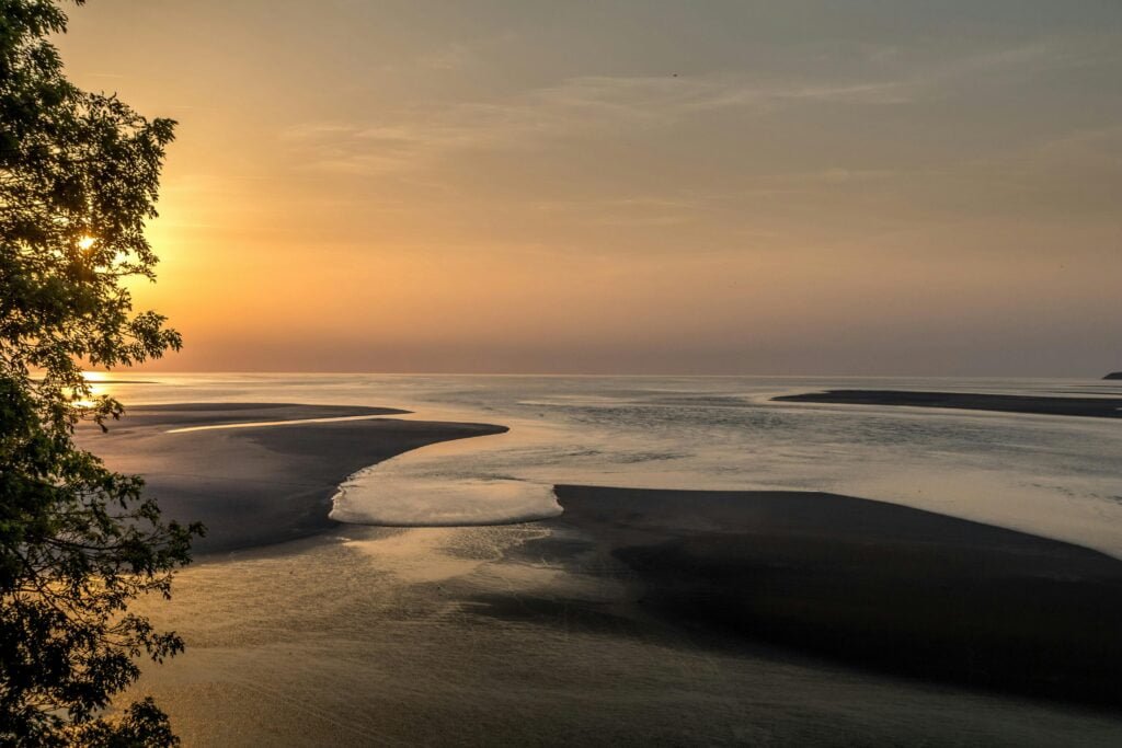 A Rising Tide during Sunset showcasing rising sea levels