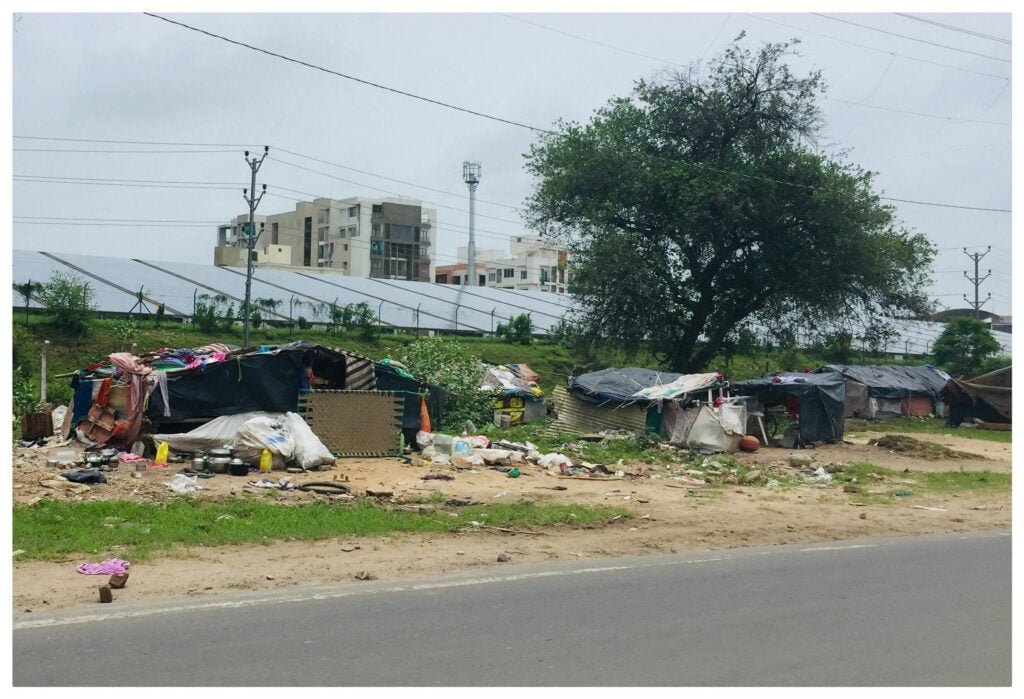 Houses Near Concrete Road representing climate change and poverty in India