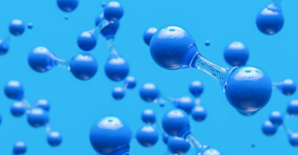 Hydrogen Molecules Against Blue Background to show hydrogen energy