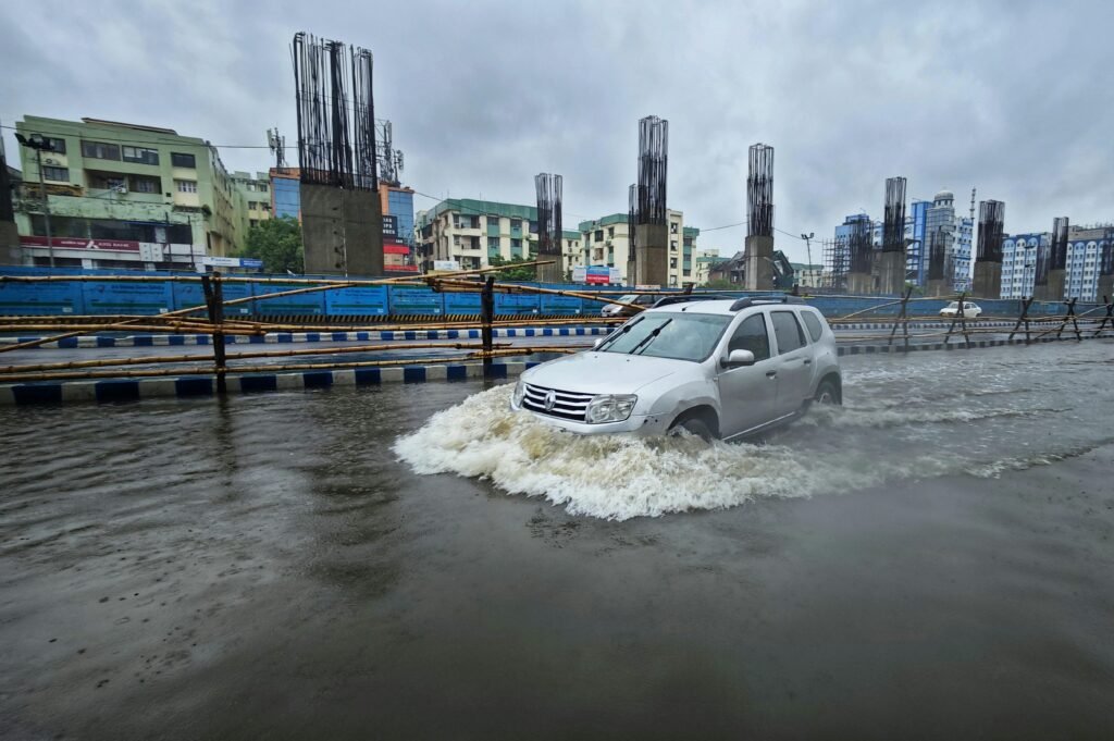 Car on Street in City during Flood, monsoon in India